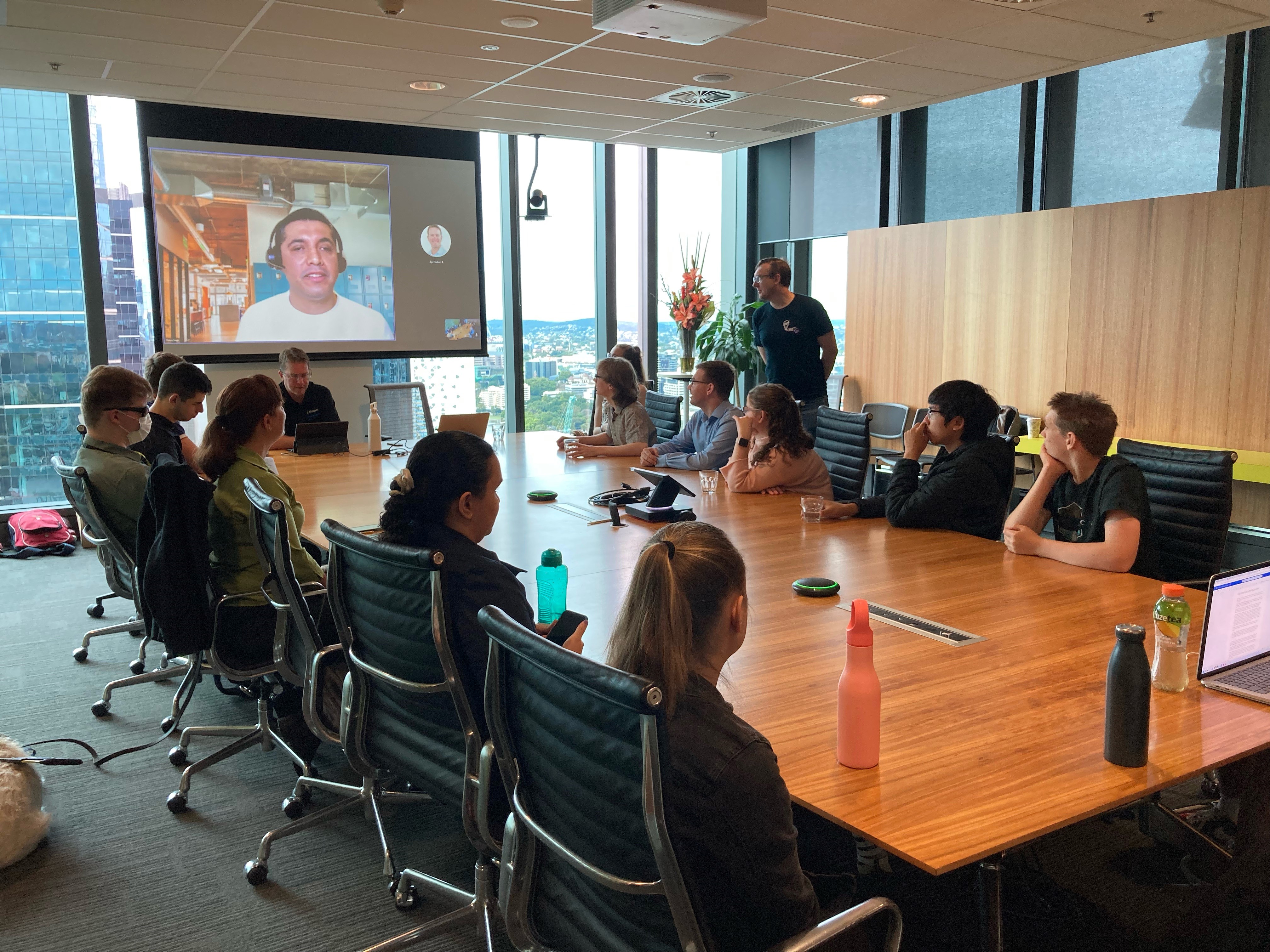 "The attendees watching Kenny's presentation at Microsoft's offices."