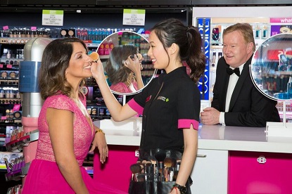 Carols by Candlelight iconic performer Silvie Paladino having her makeup refreshed by a Priceline Pharmacy Beauty Advisor Catt with legendary performer Denis Walter.