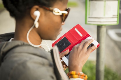 Image shows a women using a smartphone